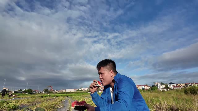 Young Farmer Eating Watermelon