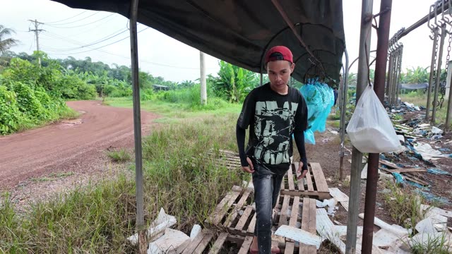 Man Walking Away From Shed