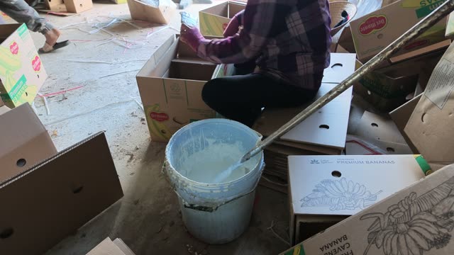 Woman Sealing Banana Box