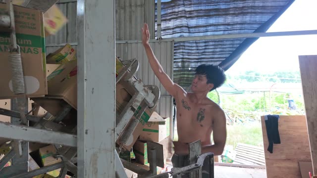 Man Operating Box Machine