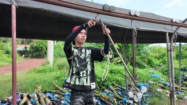 Worker Adjusting Overhead Rail Hook System