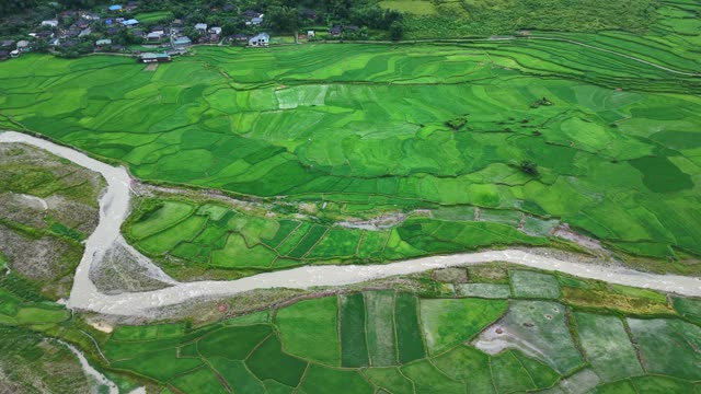 Rice Terraces Above Village Buildings