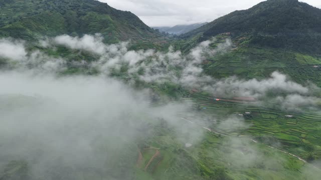 Misty Terraced Valley Between Mountains