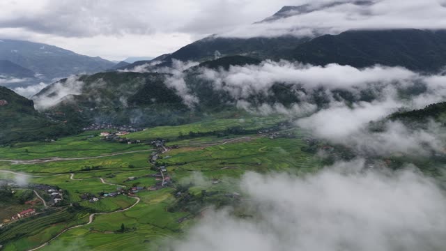 Village Emerging From Mountain Clouds
