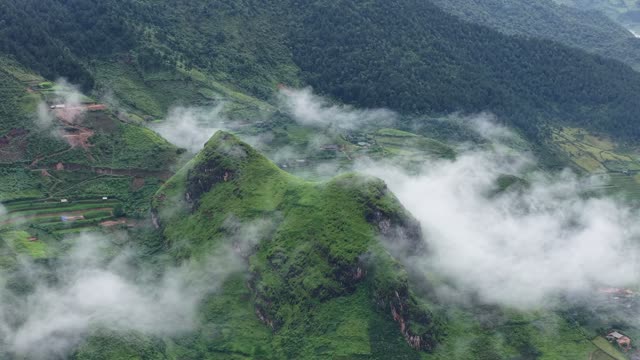 Terraced Fields Peeking Through Clouds