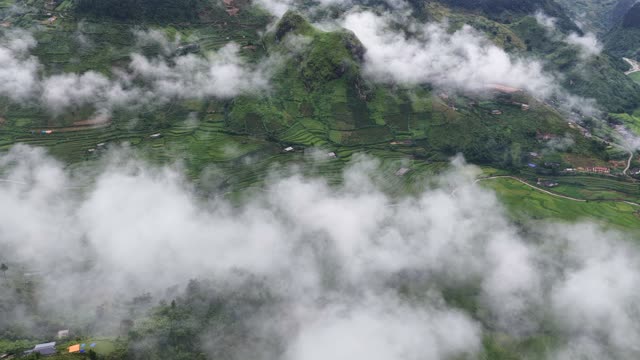 Terraced Peak Emerging From Clouds