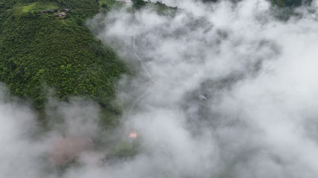 Hillside Village Among Clouds