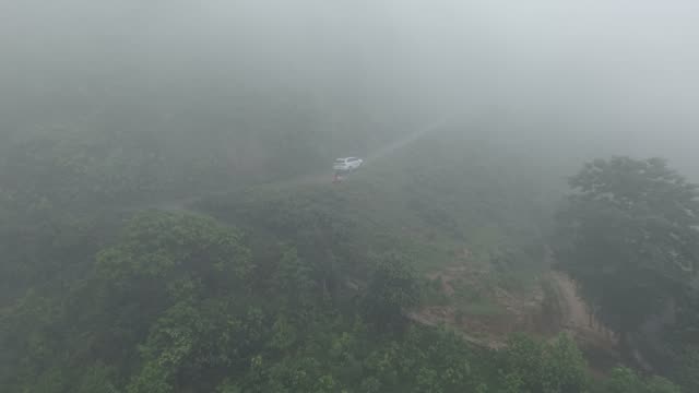 Car On Foggy Mountain Road