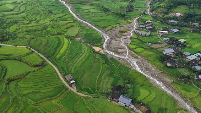 River Winding Through Village Terraces