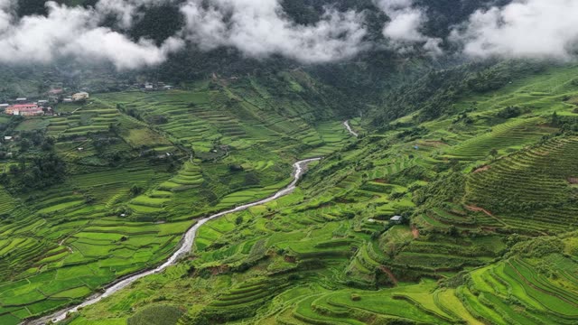 River Valley Beneath Rolling Clouds