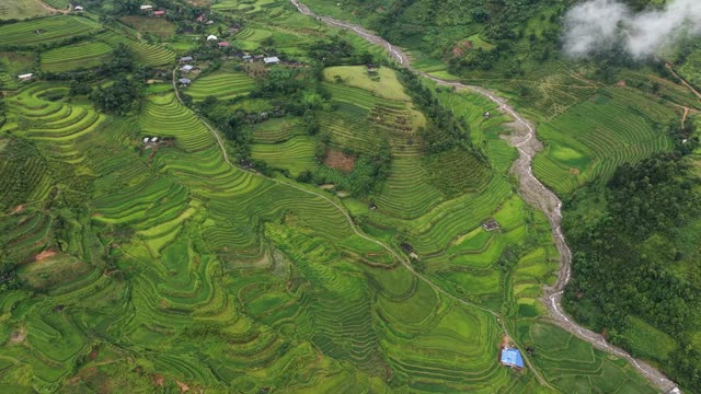 Village Terraces Under Drifting Clouds