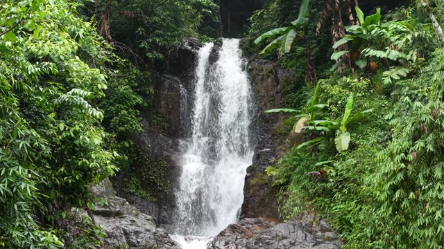Wide Waterfall Over Rocky Cliff