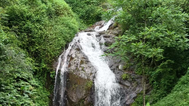 Waterfall On Rocky Cliff Face