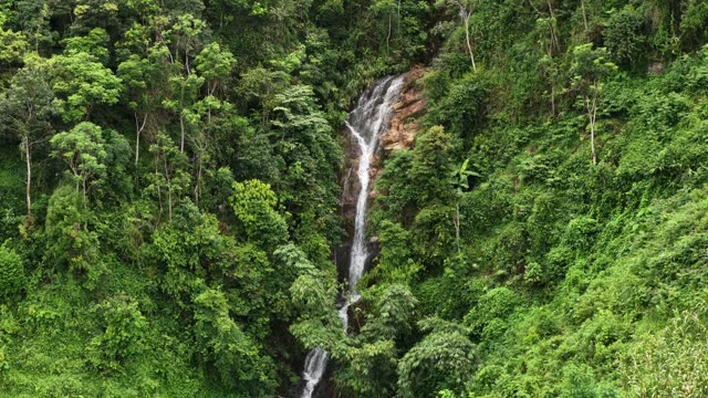 Waterfall Streaming Down Rocky Cliff
