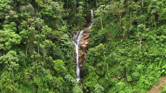 Waterfall Over Reddish Rock Face