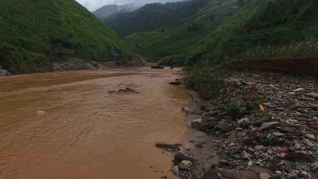 FPV Skimming Terraces Near Flooded Field