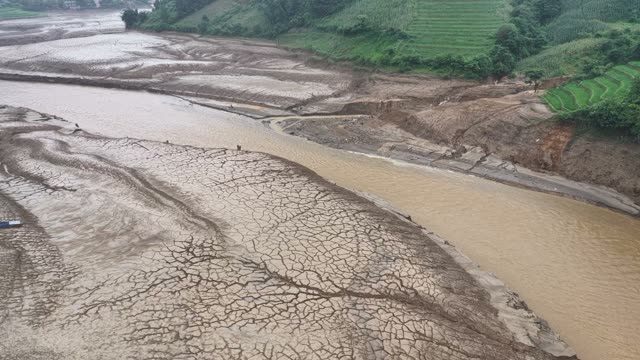Dried Mudflat Along River Bend