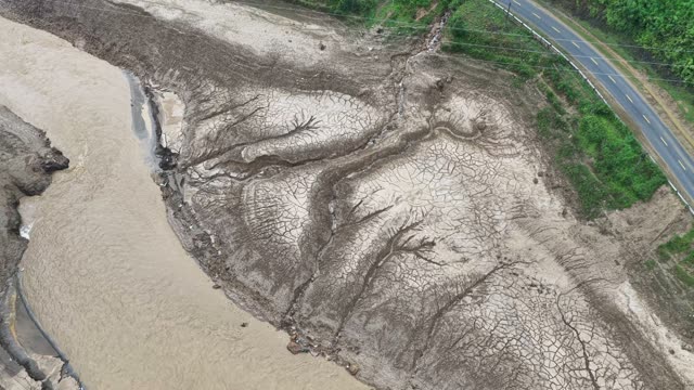 Cracked Riverbank With Branching Patterns