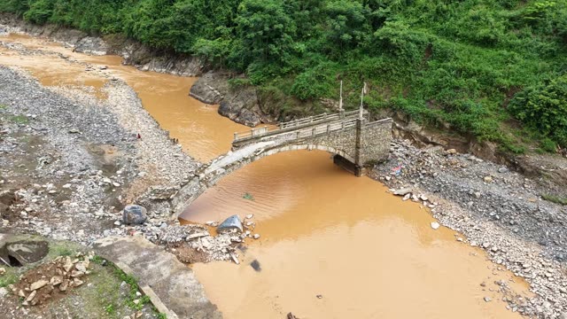 Stone Bridge Over Muddy River