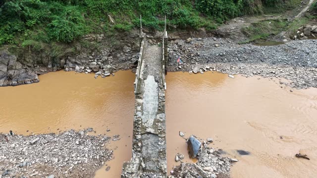 Wooden Bridge Over Muddy River