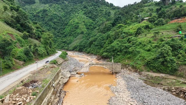 Mountain Road Along River Valley