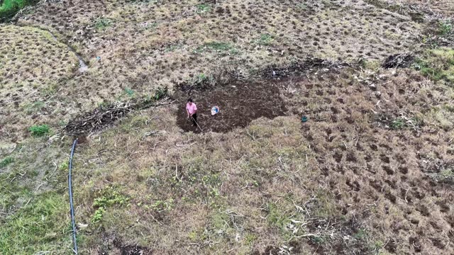 Farmers Tilling Dry Field Patch