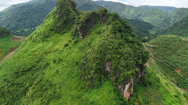 Sharp Karst Peak Over Valley