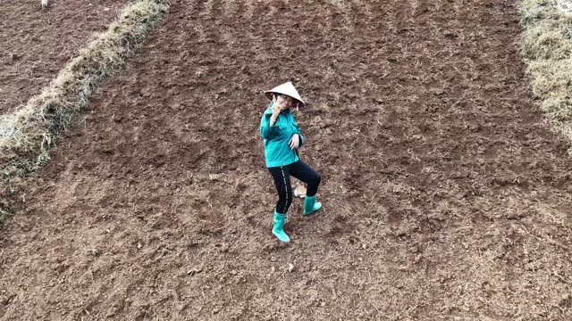 Farmer Standing In Freshly Tilled Field