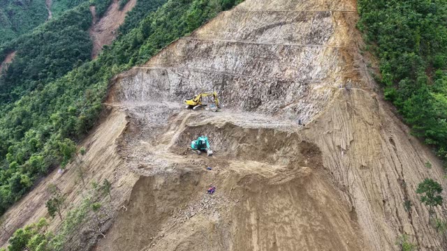 Excavators Carving Mountain Road