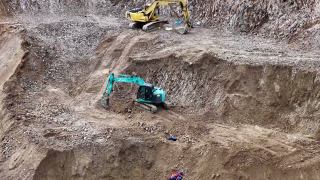 Excavators On Rocky Mountain Pit