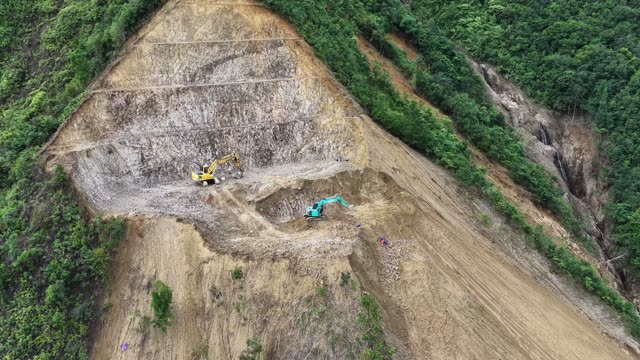 Machinery On Steep Mountain Ridge