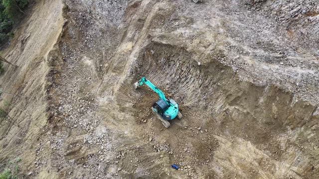 Excavator Digging Mountain Road Path