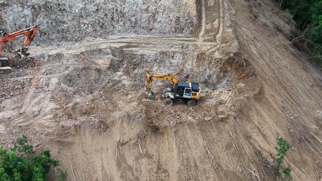 Machinery Working Rocky Slope