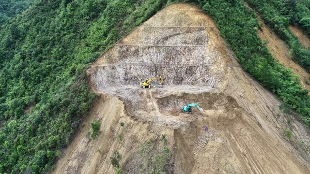 Excavator Cutting Steep Slope