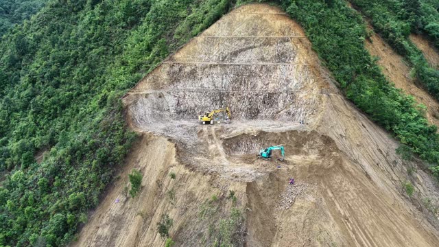 Machinery On Bare Mountain Slope
