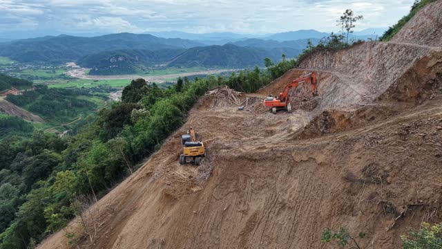 Machinery Clearing Steep Mountain Road