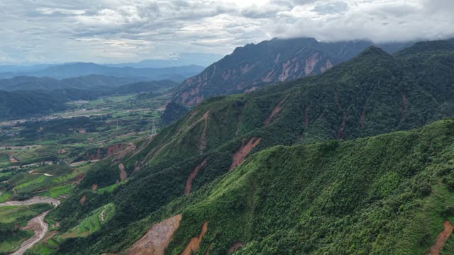 Mountain Road Curving Past Rock Face