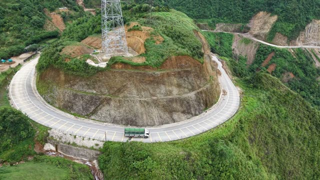 Truck Passing Waterfall By Road