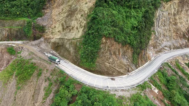 Excavators Working Steep Rock Cliff