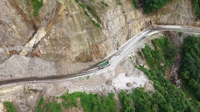 Truck Rounding Cliffside Curve