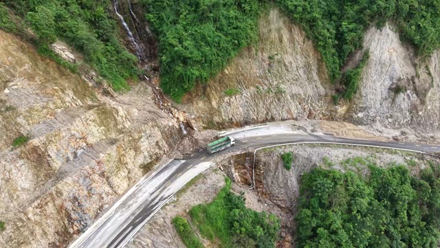 Truck On Mountain Road By Power Tower