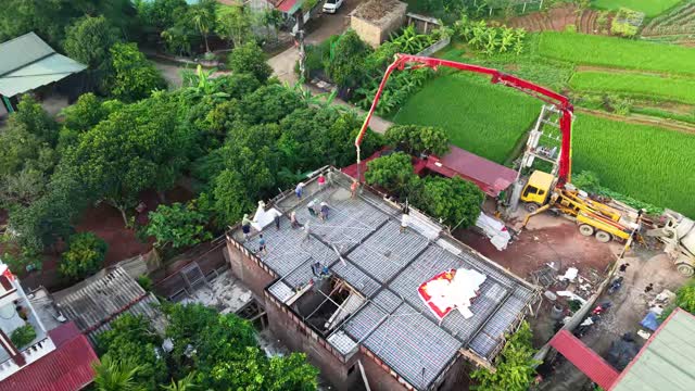 Aerial Workers On House Deck