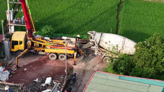 Mixer Truck Feeding Concrete Pump