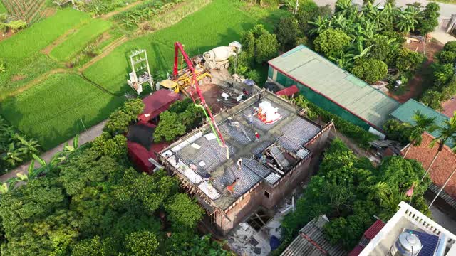 Red Pump Boom Over Roof
