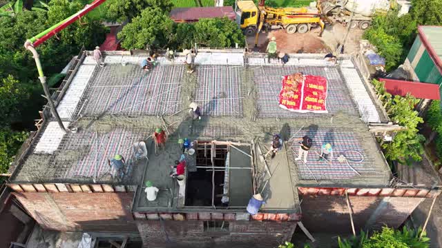 Overhead Crew Pouring Concrete