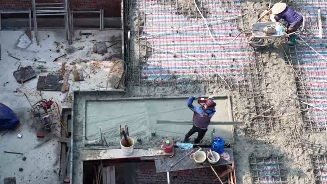 Crew Finishing Roof Concrete