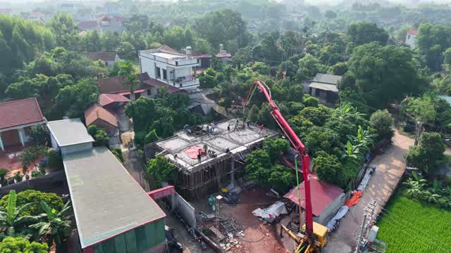 Workers Pouring Rooftop Concrete