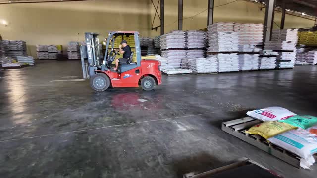 Warehouse Forklift Moving Feed