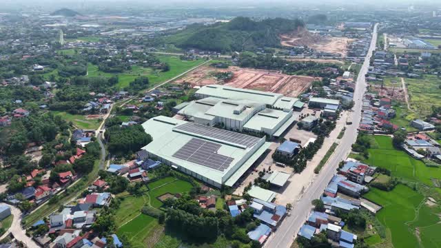 Aerial Factory Among Rice Fields