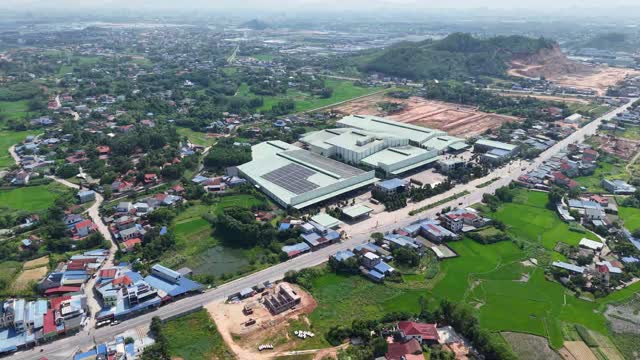 Aerial Factory Among Rice Fields
